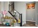 Beautiful staircase featuring modern black railings and decorative elements that enhance the home's aesthetic at 2577 Tolmezzo St, Henderson, NV 89044