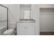 Bright bathroom featuring granite counters, white cabinets, and a tiled shower in a modern design at 2618 Lily Point St, Las Vegas, NV 89156