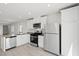 Contemporary kitchen with white cabinets, stainless steel appliances, and an open design at 2618 Lily Point St, Las Vegas, NV 89156