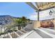Spacious balcony with panoramic views of rolling hills, palm trees, and a blue sky at 30 Via Tiberius Way, Henderson, NV 89011