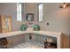 This half-bath features custom concrete countertops, vessel sink, unique mirror, and beautiful tile flooring at 30 Via Tiberius Way, Henderson, NV 89011