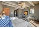 Inviting bedroom with rustic wood beams, ceiling fan and cozy decor at 30 Via Tiberius Way, Henderson, NV 89011