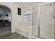 Well-lit bathroom featuring a separate shower and tub, complemented by white tile and modern fixtures at 3320 Indian Moon Dr, Las Vegas, NV 89129