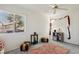 Bright bedroom with neutral tones, including a comfortable seating area and a window offering outdoor views at 3320 Indian Moon Dr, Las Vegas, NV 89129