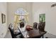 Bright dining room features high ceilings, carpet flooring, and a large wooden dining table with upholstered chairs at 3320 Indian Moon Dr, Las Vegas, NV 89129