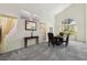Light and airy dining room with high ceilings, multiple windows, and plush carpet at 3320 Indian Moon Dr, Las Vegas, NV 89129