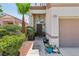 Inviting home entryway featuring desert landscaping, and a covered porch at 3320 Indian Moon Dr, Las Vegas, NV 89129