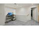 Open loft area features neutral carpet, recessed lighting, and adjacent doorway at 3320 Indian Moon Dr, Las Vegas, NV 89129