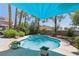 Inviting backyard pool area with a blue canopy, lush greenery, and a well-maintained concrete patio at 3320 Indian Moon Dr, Las Vegas, NV 89129