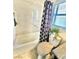 Bright bathroom with a bathtub, modern toilet, and updated vanity at 3329 Hidden Ridge St, Las Vegas, NV 89129