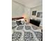 Well decorated primary bedroom features a decorative wall, stylish bedding, and a dark wood dresser at 3329 Hidden Ridge St, Las Vegas, NV 89129