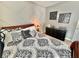 Tastefully decorated primary bedroom features a decorative accent wall, stylish bedding, and a dark wood dresser at 3329 Hidden Ridge St, Las Vegas, NV 89129