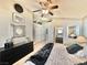 Cozy bedroom featuring a ceiling fan, carpet, and ensuite bathroom at 3329 Hidden Ridge St, Las Vegas, NV 89129