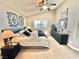 Bedroom with vaulted ceilings, decorative wall art, and a view of the window at 3329 Hidden Ridge St, Las Vegas, NV 89129