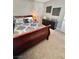 Inviting bedroom features a decorative accent wall, plush bedding, and a functional dark wood dresser at 3329 Hidden Ridge St, Las Vegas, NV 89129