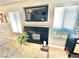 A decorative fireplace with a mounted tv and tiled floor and modern decor at 3329 Hidden Ridge St, Las Vegas, NV 89129