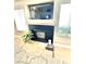 Close-up of the fireplace with a mounted tv, complemented by tiled flooring and modern decor at 3329 Hidden Ridge St, Las Vegas, NV 89129