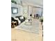 Spacious living room with a neutral color palette, dining area, and stylish decor elements at 3329 Hidden Ridge St, Las Vegas, NV 89129