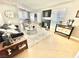 Bright living room with fireplace, modern furniture, and neutral decor at 3329 Hidden Ridge St, Las Vegas, NV 89129
