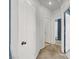 Neutral hallway featuring doors, carpeted floors, and access to various rooms in the home at 3389 Commendation Dr, Las Vegas, NV 89117