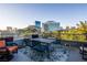 Balcony with seating offers expansive views of the city skyline and nearby attractions at 360 E Desert Inn Rd # 407, Las Vegas, NV 89109