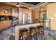 Charming kitchen with stainless steel appliances, granite countertops, and a convenient island with seating at 360 E Desert Inn Rd # 407, Las Vegas, NV 89109