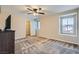 Spacious bedroom with carpet, ceiling fan, and closet access at 3605 Sapphire Sea Ct, North Las Vegas, NV 89031