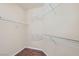 Empty walk-in closet with white wire shelving and hardwood floors at 3605 Sapphire Sea Ct, North Las Vegas, NV 89031