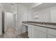 Modern bathroom featuring dual sinks, quartz countertops and a walk-in shower at 4253 Gold Desert St, North Las Vegas, NV 89032