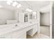Bathroom with double sinks, a full mirror, and access to bedroom at 4324 Peaceful Path Ct, North Las Vegas, NV 89032