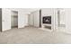 Spacious bedroom with plush carpeting, a cozy fireplace, and ample closet space at 4324 Peaceful Path Ct, North Las Vegas, NV 89032
