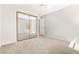 Bedroom with carpet flooring and mirrored sliding closet doors at 4324 Peaceful Path Ct, North Las Vegas, NV 89032