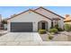 Charming home with well-maintained yard, two-car garage, and stucco walls at 4324 Peaceful Path Ct, North Las Vegas, NV 89032