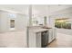 Open-concept kitchen with sleek appliances and bar seating at 4324 Peaceful Path Ct, North Las Vegas, NV 89032