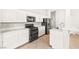 Modern kitchen with white cabinets and sleek appliances at 4324 Peaceful Path Ct, North Las Vegas, NV 89032