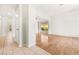 Bright living room featuring wood floors, and a large window at 4324 Peaceful Path Ct, North Las Vegas, NV 89032