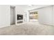 Living room showcasing a fireplace and sliding glass doors to the backyard at 4324 Peaceful Path Ct, North Las Vegas, NV 89032