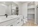Modern bathroom with double vanity, marble countertops, sleek fixtures, and a glass-enclosed shower at 4433 Pioche Ave, North Las Vegas, NV 89032