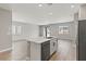 Open-concept kitchen island with marble countertop, stainless steel appliances, and wood flooring at 4433 Pioche Ave, North Las Vegas, NV 89032