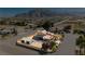 Beautiful aerial view of home with large lot, mountain views, and storage shed at 4620 N Tee Pee Ln, Las Vegas, NV 89129