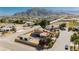 Gorgeous property featuring a home with tile roof, mountain backdrop, and fenced yard at 4620 N Tee Pee Ln, Las Vegas, NV 89129