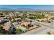 Panoramic aerial view showcasing a tan stucco house with tiled roof and a shed on a large lot at 4620 N Tee Pee Ln, Las Vegas, NV 89129