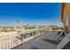 Balcony with lounge chairs and outdoor seating, perfect for enjoying the surrounding scenery at 4620 N Tee Pee Ln, Las Vegas, NV 89129