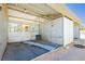 View of horse barn's interior, stalls, open design, and a simple lighting system at 4620 N Tee Pee Ln, Las Vegas, NV 89129