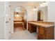 Bathroom vanity area with tile counters and access to a soaking tub at 4620 N Tee Pee Ln, Las Vegas, NV 89129
