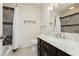 Well-lit bathroom featuring granite counters, decorative tile, and shower with bathtub at 4620 N Tee Pee Ln, Las Vegas, NV 89129