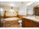 Elegant bathroom features a separate shower, jacuzzi tub, and vanity sink at 4620 N Tee Pee Ln, Las Vegas, NV 89129