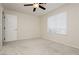 Bright bedroom featuring a window and closet with white doors at 4620 N Tee Pee Ln, Las Vegas, NV 89129