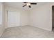 Spacious bedroom with neutral carpet and double closet at 4620 N Tee Pee Ln, Las Vegas, NV 89129