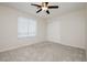 Bright bedroom with neutral carpet and large window at 4620 N Tee Pee Ln, Las Vegas, NV 89129